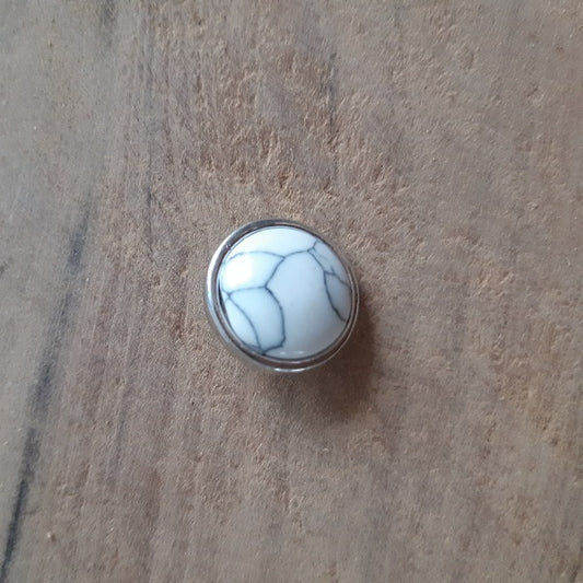 Pression howlite